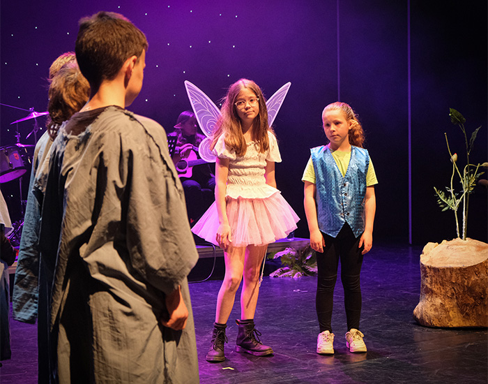 Children performing in the Y Coedwig Hud story by Mared Llywelyn