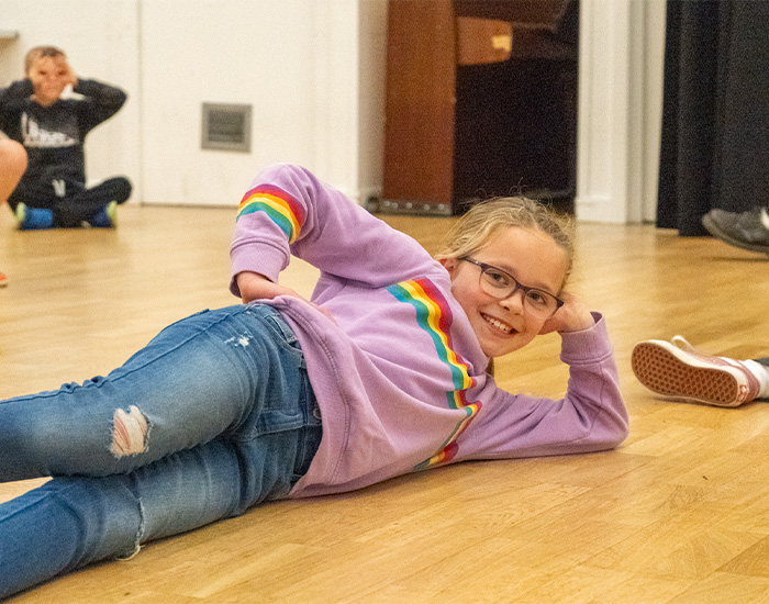 A child on laying on the floor